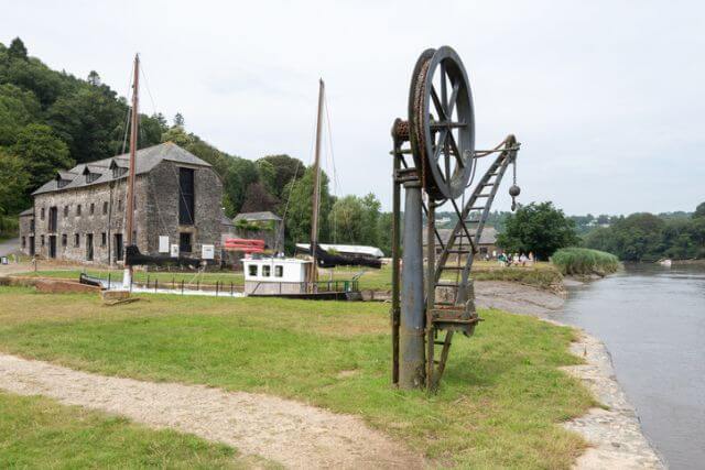 A view of the discovery centre and a crane at Cotehele Quay, a National Trust property near Calstock in Cornwall.