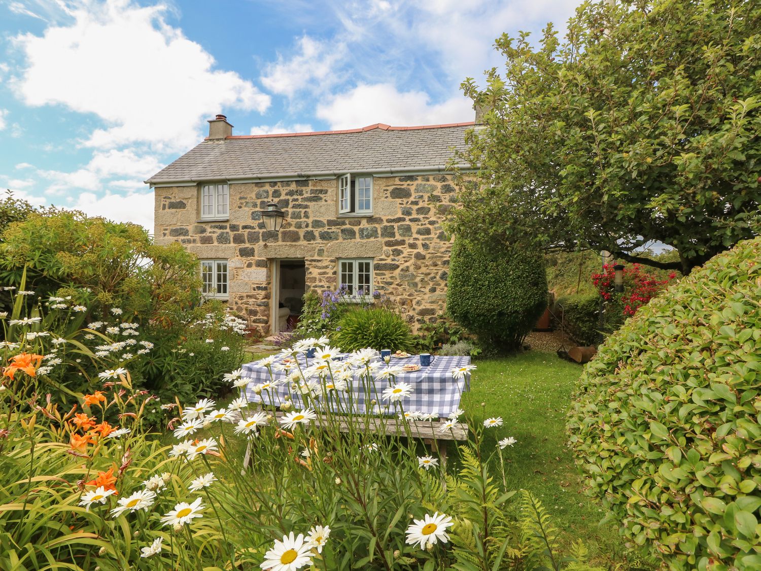 Higher Roskorwell Farm Cornwall - garden with picnic bench, ready for the spring