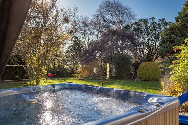 Hot tub in garden of holiday home include use in guest information folder