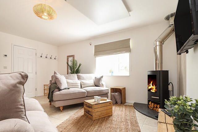 cosy interiors and log fire at the old post office holiday home