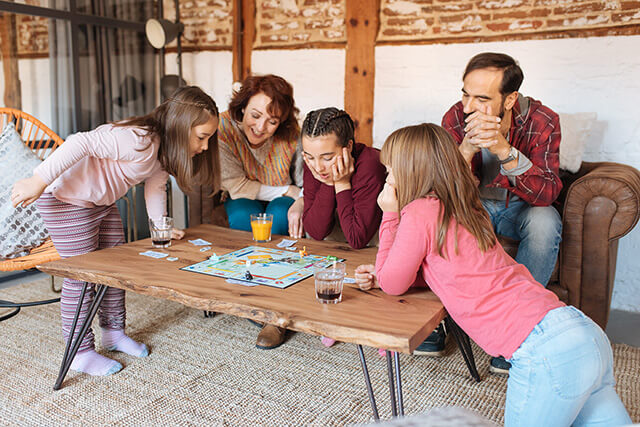 family playing board games at christmas