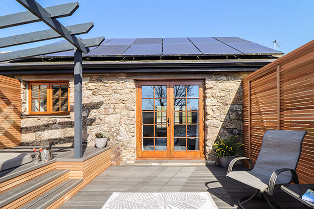 Rosewarrick Cottage Outdoor Area with Solar Panels.