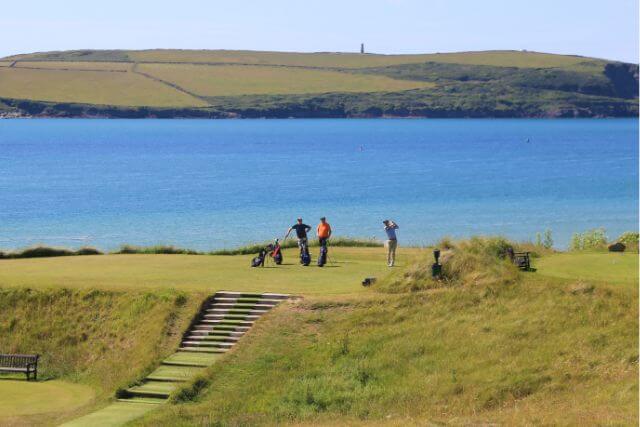 A view of St Enodoc Golf Club course with the Camel Estuary in the background in Rock, Cornwall.