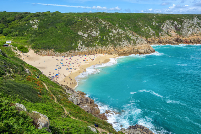 Aerial view of Porthcurno Beach and cliffs