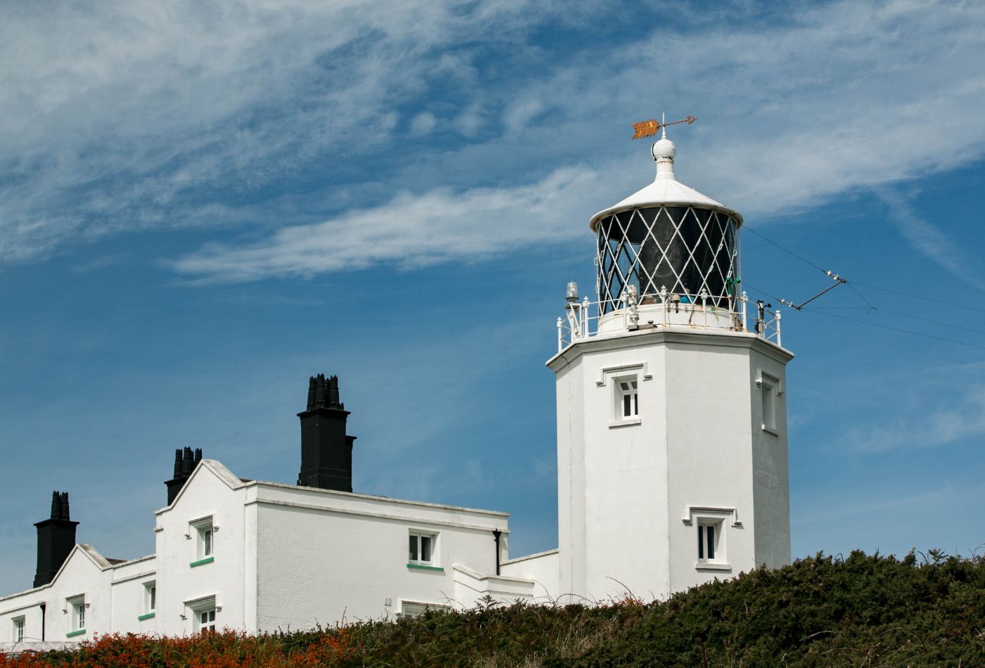 Outside view of Lizard Lighthouse against a blue sky