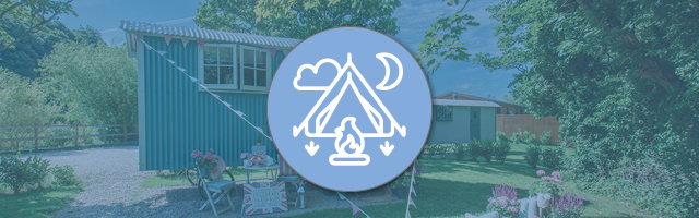 A banner showing a shepherd's hut with a glamping icon in the foreground