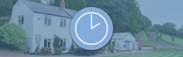 A banner showing a holiday cottage and a clock icon in the foreground