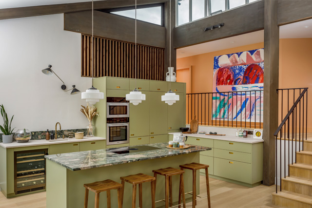 A kitchen with green units, designed by Studio Far West