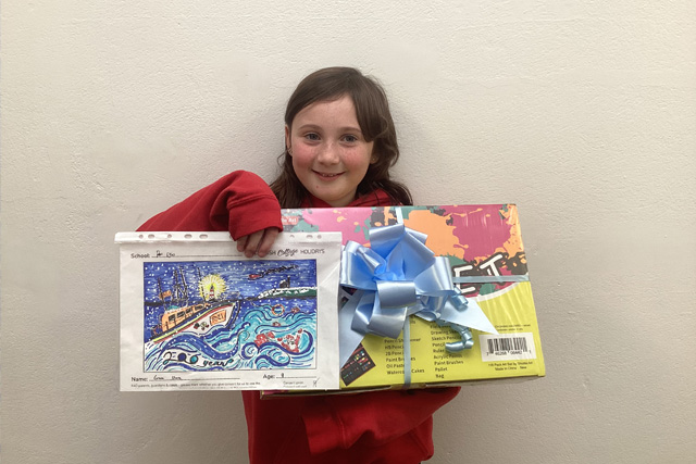 Grace Shore with her winning Christmas card design